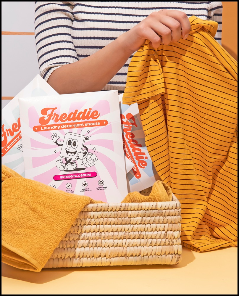 Freddie laundry product in a woven basket