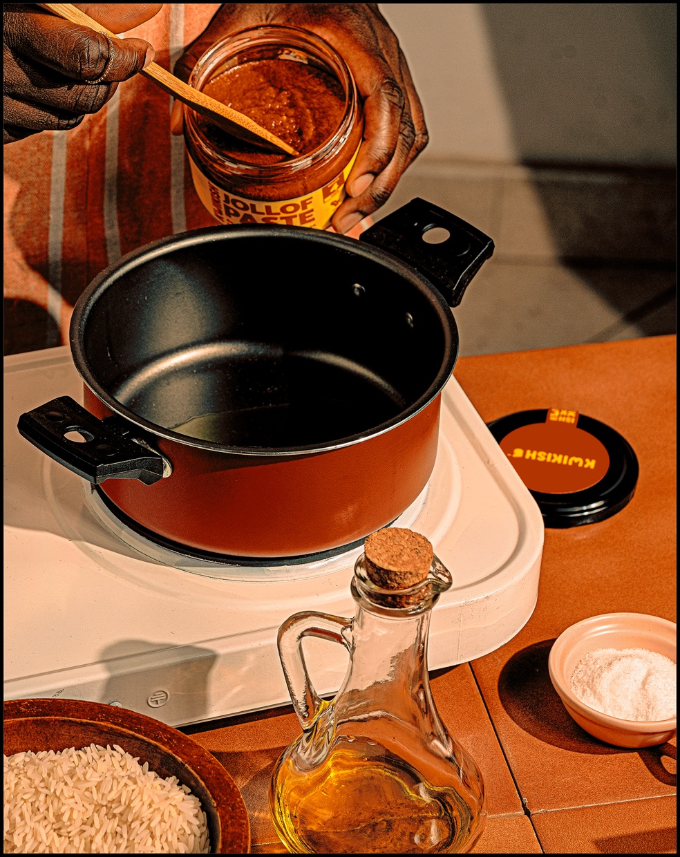 Cooking scene with a pot, olive oil and spices